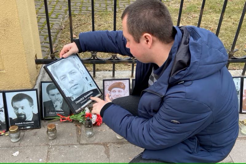 Photos of journalists targeted by the Belarusian regime are on display outside the Belarusian embassy in Vilnius. Dzmitry Zavadski disappeared in 2000, presumed murdered by forces acting for Lukashenko.(ABC News: Steve Cannane)