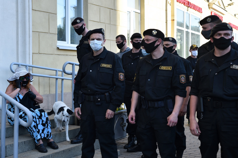Belarus riot police officers are seen patrolling a rally held on June 19, 2020, in support of opposition candidates who seek to unseat President Aleksandr Lukashenko in the August 9, 2020, election. (AFP/Sergei Gapon)