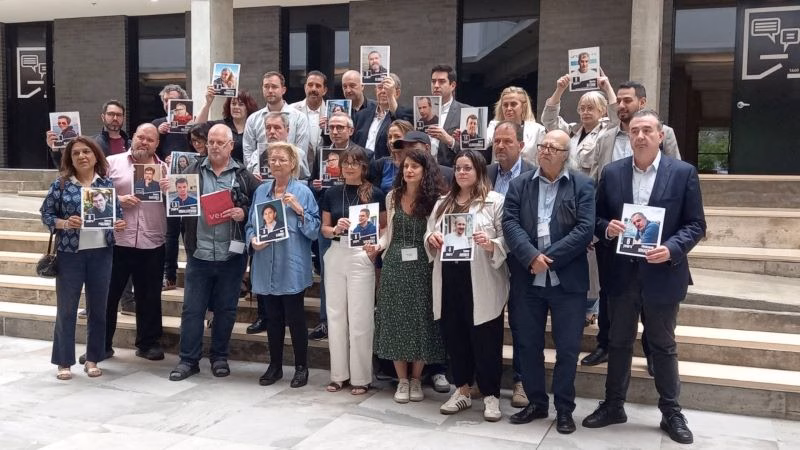 IFJ representatives stand in solidarity with imprisoned Belarusian journalists during the Annual General Meeting and Executive Committee meeting in Montreal, Canada